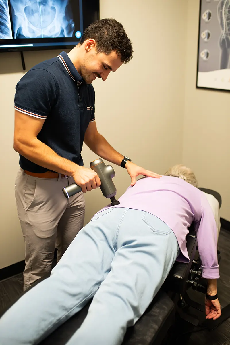 Dr. Mark of Delta Chiropractic in Rochester Hills, MI Performing Adjustment For Low Back Pain.